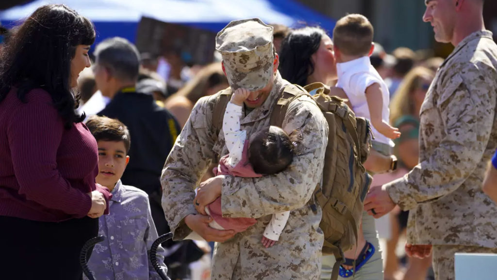 At the homecoming at Camp Pendleton on Sunday, Oct. 3, 2021 in Oceanside, CA., Lance Cpl. Nathan Sweet holds his 8-month old daughter, Sabrina, as his wife Selena and son, Damian also welcome Nathan home. (Nelvin C. Cepeda/The San Diego Union-Tribune)